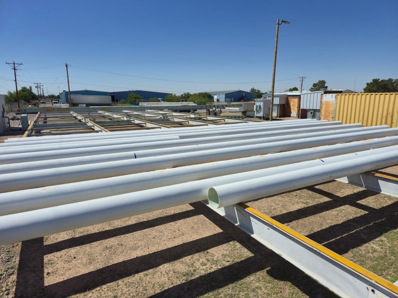 Rows of large-diameter composite pipe in the New Mexico yard
